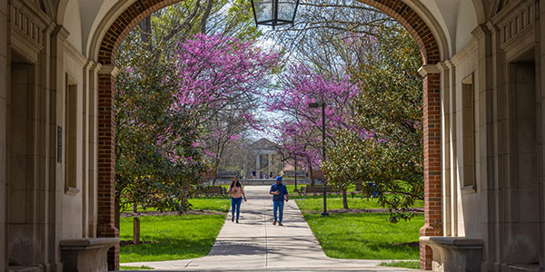 Students walking on Miami University's Oxford campus near Upham Hall