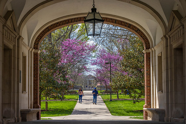 Students walking on Miami University's Oxford campus near Upham Hall