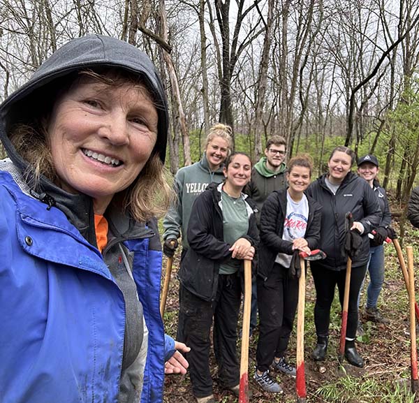 Helaine Alessio with several students on a trail in Hueston Woods