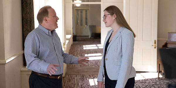 Zeb Baker, founding executive director of Miami University's Honors College, talks to Honors College student Cameron Tiefenthaler.