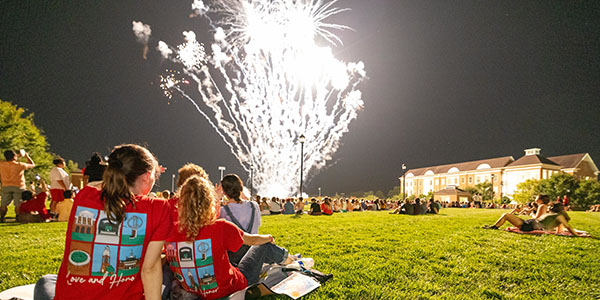 Students watch the fireworks display during the 2023 Welcome Weekend at Miami University.