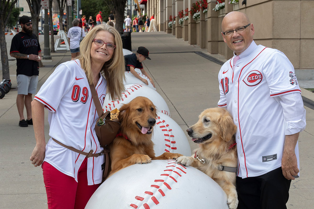 University Ambassador Dr. Renate Crawford and Miami President Greg Crawford at Great American Ball Park's Bark in the Park with their dogs, Newton and Ivy