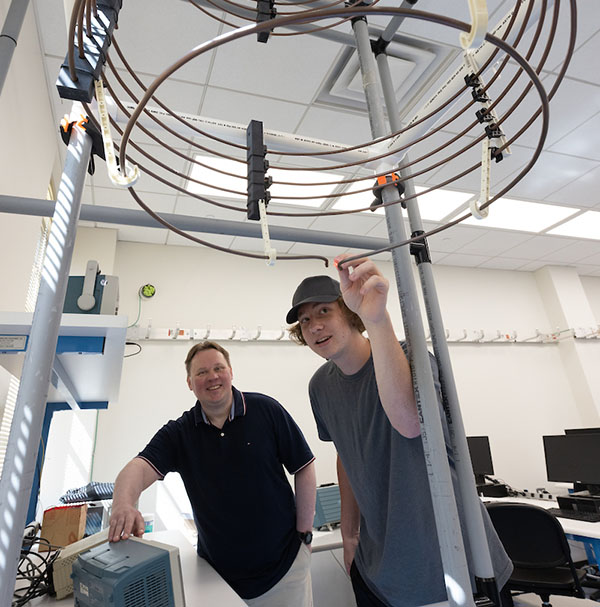 Dmitriy Garmatyuk and a student in his lab