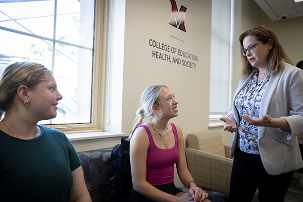 Elise Radina, who starts in the role of associate provost on Oct. 21, meets with Miami University students in McGuffey Hall.