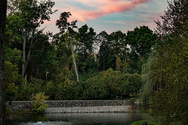 The bridge on Western Drive next to the duck pond with sunset clouds above