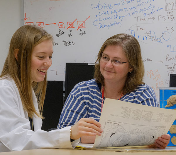 Jennifer Quinn with a student 