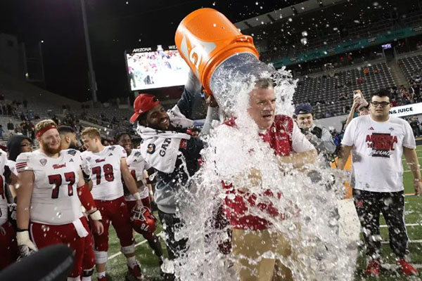 Miami University head football coach Chuck Martin celebrates after the RedHawks' win in the Arizona Bowl.