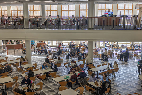 View from above the Armstrong Student Center dining commons with many students at tables