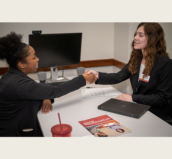 A career advisor in Miami University's Center for Career Exploration and Success conducts a mock interview with a student