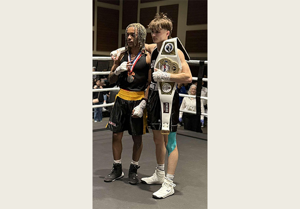 Miami University senior Daniel Gomez recently won the National Collegiate Boxing Association’s national championship for his 125-pound weight class. He stands beside his opponent, who was last year's champ