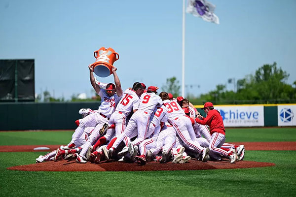 Miami University baseball players celebrate winning the MAC Tournament