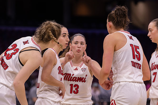 Tamar Singer, center, and the Miami University women's basketball team