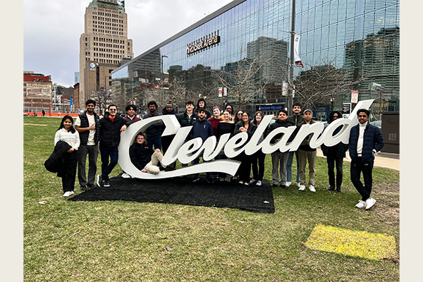 Into the LAND participants pose for a group picture out front of Rocket Arena