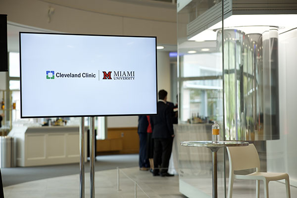 Cleveland Clinic and Miami University logos on a screen