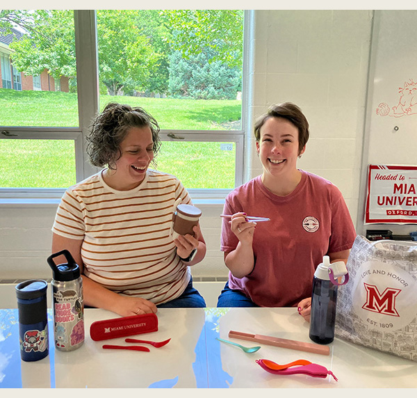 Dani cimino and kenzie bryant with a selection of reusable items , cutlery and water bottles 