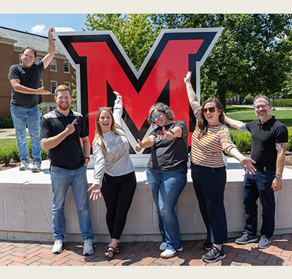 Members of the office of University Communications and Marketing pose at the new RedHawk Plaza (photos by Scott Kissell)
