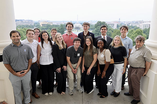Inside Washington program, summer 2026,  participants pose on the Speakers Balcony in Washington, D.C.  